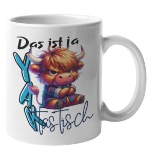 Weiße Kaffeetasse mit einer Illustration eines mürrischen Hochlandrinds im Karohemd und dem Wortspiel-Schriftzug „Das ist ja YAKtastisch“.